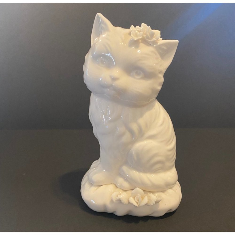 Domesticated white kitty cat figurine with applied flowers